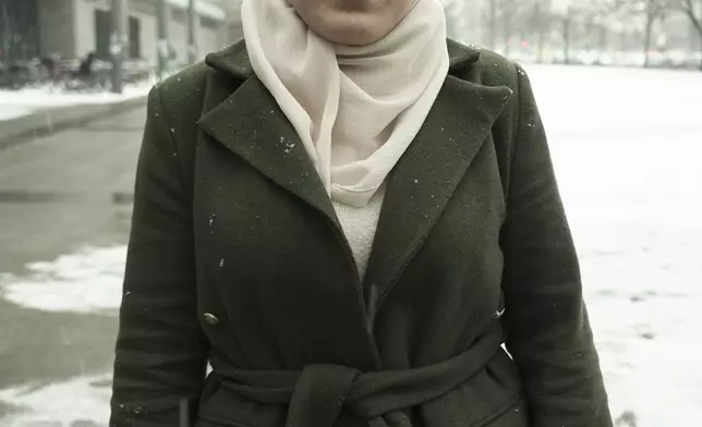 Sedra Hanina, 23 years old, coming to Germany in 2016 from Syria, pose for a photo after an interview with the Associated Press in Berlin, Wednesday, Feb. 19, 2025. (AP Photo/Pietro De Christfaro)