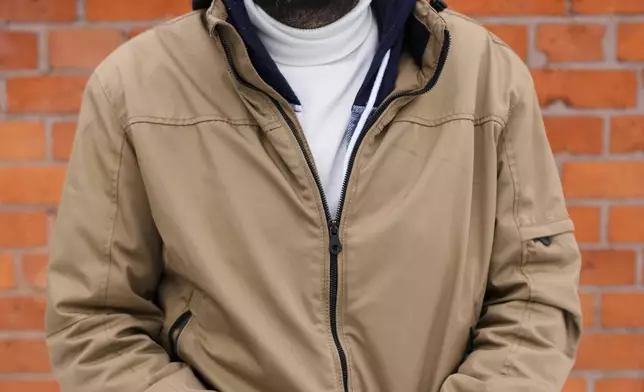 Syamend Al Othman 31, coming to Germany in 2014 from Syria, pose for a photo during an interview with the Associated Press in Berlin, Germany, Thursday, Feb. 13, 2025. (AP Photo/Markus Schreiber)