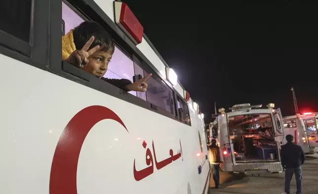 A Palestinian boy injured in the Israeli military's ground and air offensive on Gaza, looks from an ambulance as the first group of sick Gaza children arrives in Jordan for medical treatment at the King Hussein Bridge border crossing on Tuesday, March 4, 2025. (AP Photo/Raad Adayleh)
