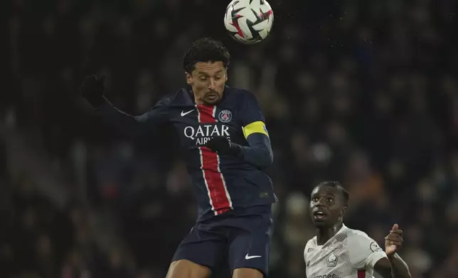 PSG's Marquinhos heads the ball during the French League One soccer match between Paris Saint-Germain and Lille, Saturday, March 1, 2025 at the Parc des Princes stadium in Paris. (AP Photo/Christophe Ena)
