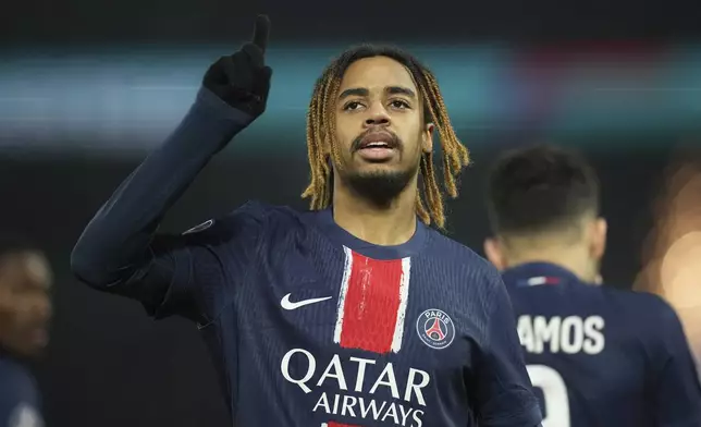 PSG's Bradley Barcola celebrates scoring his side first goal during the French League One soccer match between Paris Saint-Germain and Lille, Saturday, March 1, 2025 at the Parc des Princes stadium in Paris. (AP Photo/Christophe Ena)