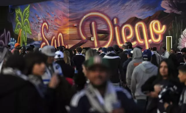 Fans arrive before San Diego FC hosts St. Louis City in an MLS soccer match Saturday, March 1, 2025, in San Diego. (AP Photo/Gregory Bull)