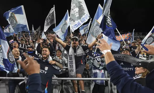 San Diego FC fans sing before the team hosts St. Louis City in an MLS soccer match Saturday, March 1, 2025, in San Diego. (AP Photo/Gregory Bull)