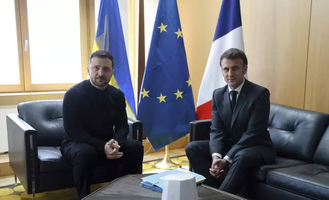Ukraine's President Volodymyr Zelenskyy, left, meets French President Emmanuel Macron on the sidelines of the European Council to discuss continued support for Ukraine and European defense, in Brussels, Thursday, March 6, 2025. (Ludovic Marin, Pool via AP)