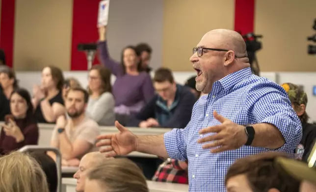 Michael Bretz raises his voice over the commotion to make a comment during a GOP town hall meeting with Reps. Celeste Maloy and Mike Kennedy, R-Utah, Thursday, March 20, 2025, in Salt Lake City. (AP Photo/Rick Egan)