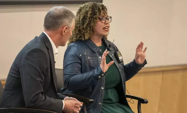 Reps. Mike Kennedy and Celeste Maloy, R-Utah, answer questions during a GOP town hall meeting Thursday, March 20, 2025, in Salt Lake City. (AP Photo/Rick Egan)
