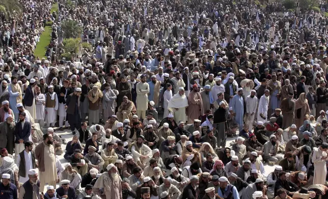 Mourners attend the funeral prayer of a senior Muslim cleric, Hamidul Haq who was killed in the Friday's suicide bomb attack at a pro-Taliban seminary in Akora Khattak, Pakistan, Saturday, March 1, 2025. (AP Photo/Muhammad Sajjad)