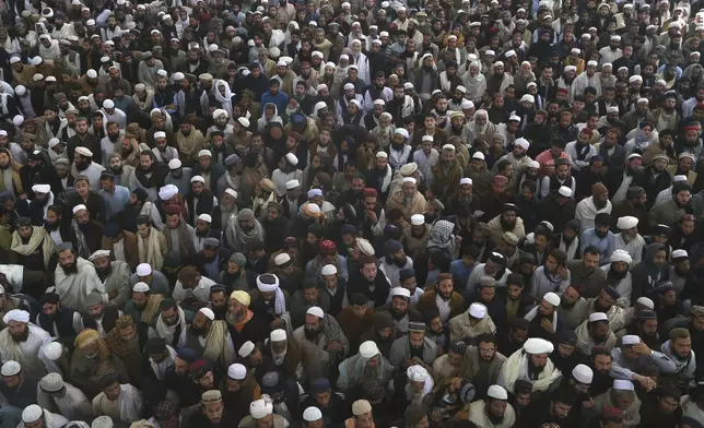 Mourners attend the funeral prayer of a senior Muslim cleric, Hamidul Haq who was killed in the Friday's suicide bomb attack at a pro-Taliban seminary in Akora Khattak, Pakistan, Saturday, March 1, 2025. (AP Photo/Muhammad Sajjad)