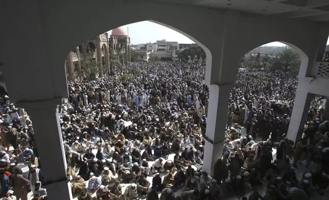 Mourners attend the funeral prayer of a senior Muslim cleric, Hamidul Haq who was killed in the Friday's suicide bomb attack at a pro-Taliban seminary in Akora Khattak, Pakistan, Saturday, March 1, 2025. (AP Photo/Muhammad Sajjad)