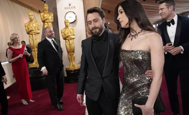 Kieran Culkin, left, and Jazz Charton arrive at the Oscars on Sunday, March 2, 2025, at the Dolby Theatre in Los Angeles. (AP Photo/John Locher)