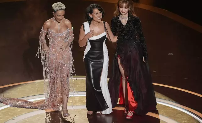 Doja Cat, from left, Raye, and Lisa on stage during the Oscars on Sunday, March 2, 2025, at the Dolby Theatre in Los Angeles. (AP Photo/Chris Pizzello)