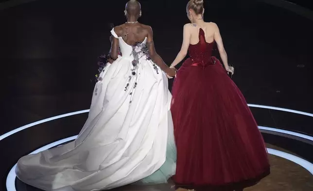 Cynthia Erivo left, and Ariana Grande on stage during the Oscars on Sunday, March 2, 2025, at the Dolby Theatre in Los Angeles. (AP Photo/Chris Pizzello)