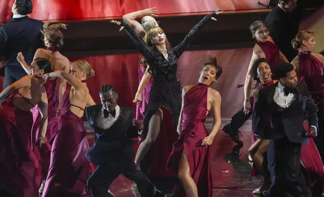 Lisa, center, sings "Live and Let Die" during the Oscars on Sunday, March 2, 2025, at the Dolby Theatre in Los Angeles. (AP Photo/Chris Pizzello)