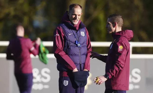England soccer manager Thomas Tuchel with assistant Anthony Barry, right, attends a training session at St George's Park, Burton upon Trent, England, Tuesday March 18, 2025. (Mike Egerton/PA via AP)