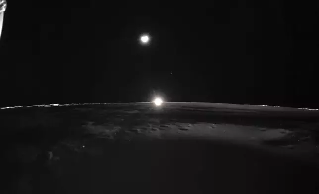 This image provided by NASA/Firefly Aerospace, Tuesday, March 18, 2025, shows the sun setting on the moon, with Earth and Venus in the distance. (NASA/Firefly Aerospace via AP)