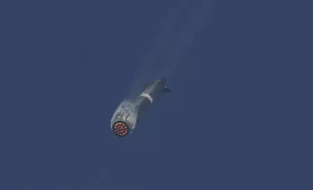 The booster of SpaceX's mega rocket Starship is recaptured during a test flight from Starbase in Boca Chica, Texas, Thursday, March 6, 2025. (AP Photo/Eric Gay)