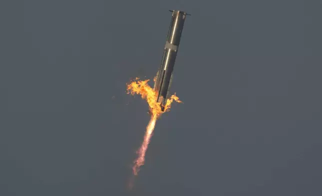 The booster of SpaceX's mega rocket Starship is recaptured during a test flight from Starbase in Boca Chica, Texas, Thursday, March 6, 2025. (AP Photo/Eric Gay)