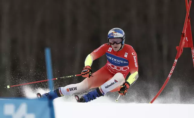 Switzerland's Marco Odermatt competes in an alpine ski, men's World Cup Giant Slalom, in Hafjell, Norway, Saturday, March 15, 2025. (AP Photo/Gabriele Facciotti)