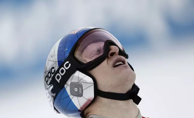 Switzerland's Marco Odermatt reacts at the finish area of an alpine ski, men's World Cup Giant Slalom, in Hafjell, Norway, Saturday, March 15, 2025. (AP Photo/Gabriele Facciotti)
