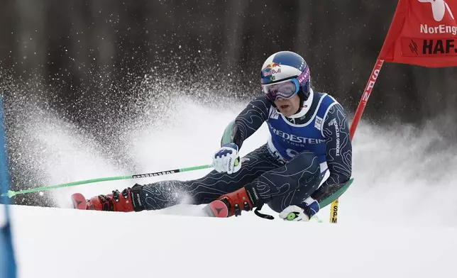 Brazil's Lucas Pinheiro Braathen competes in an alpine ski, men's World Cup Giant Slalom, in Hafjell, Norway, Saturday, March 15, 2025. (AP Photo/Gabriele Facciotti)