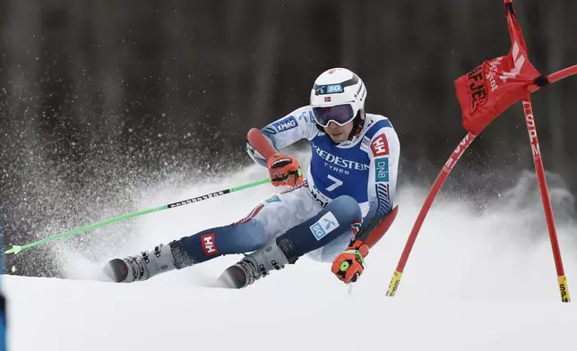 Norway's Henrik Kristoffersen competes in an alpine ski, men's World Cup Giant Slalom, in Hafjell, Norway, Saturday, March 15, 2025. (AP Photo/Gabriele Facciotti)