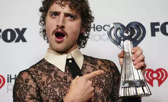 Benson Boone, winner of the award for song of the year for "Beautiful Things," poses in the press room during the iHeartRadio Music Awards, Monday, March 17, 2025, at the Dolby Theatre in Los Angeles. (Photo by Jordan Strauss/Invision/AP)