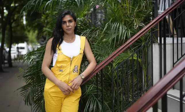 Artemis Ghasemzadeh, a migrant from Iran, poses for a portrait in Panama City, Monday, March 10, 2025, after being deported from the United States, detained for weeks in a Panamanian immigration camp, and released on a temporary humanitarian visa allowing a 30‑day stay. (AP Photo/Matias Delacroix)