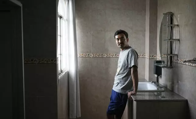 Afghan migrant Hayatullah Omagh poses for a portrait in Panama City, Monday, March 10, 2025, after being deported from the United States, detained for weeks in a Panamanian immigration camp and released on a temporary humanitarian visa allowing a 30‑day stay. (AP Photo/Matias Delacroix)