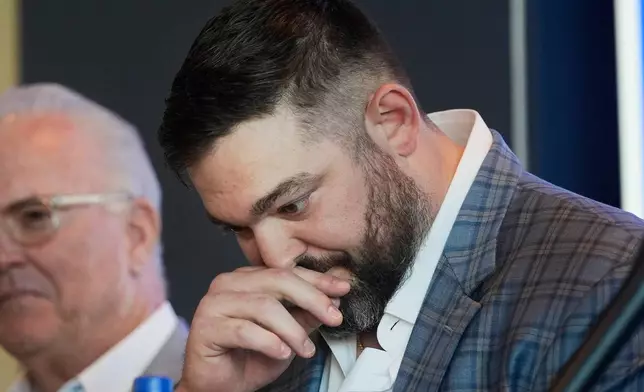 Dallas Cowboys lineman Zach Martin pauses while speaking after announcing his retirement during an NFL football press conference at the team's headquarter in Frisco, Texas, Wednesday, March 5, 2025. (AP Photo/LM Otero)