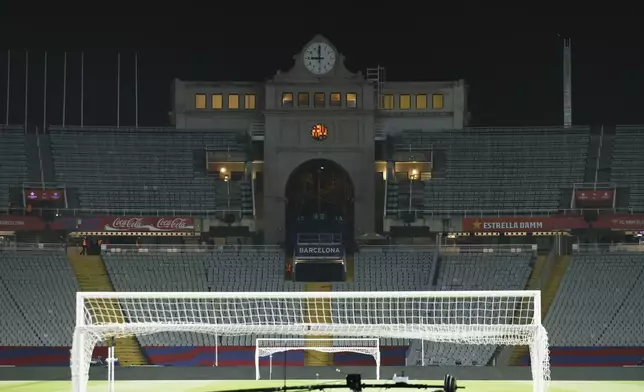 Empty stands and field seen after the cancellation of the Spanish La Liga soccer match between Barcelona and Osasuna, at the Lluis Companys Olympic Stadium, in Barcelona, Spain, Saturday, March 8, 2025. (AP Photo/Joan Monfort)
