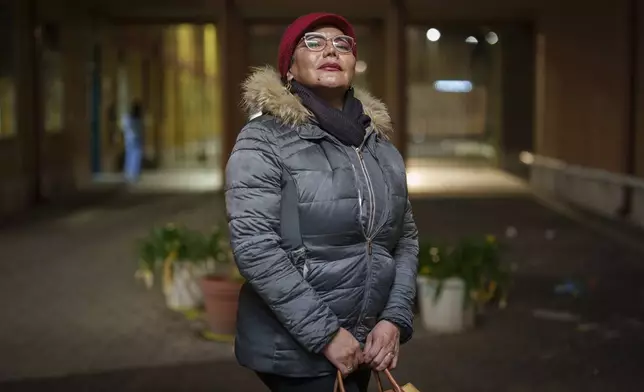 Transgender Moira Camila Garnica poses for a portrait outside the Beata Vergine Immacolata parish church in Torvaianica, Italy, Thursday, Feb. 27, 2025. (AP Photo/Bernat Armangue)