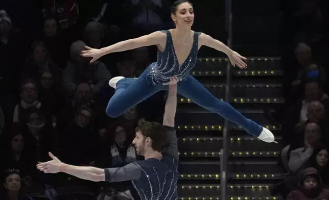 Sara Conti and Niccolo Macii, of Italy, perform during the pairs free skating program at the figure skating world championships, Thursday, March 27, 2025, in Boston. (AP Photo/Charles Krupa)