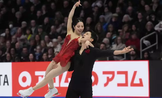 Riku Miura and Ryuichi Kihara, of Japan, perform during the pairs free skating program at the figure skating world championships, Thursday, March 27, 2025, in Boston. (AP Photo/Charles Krupa)