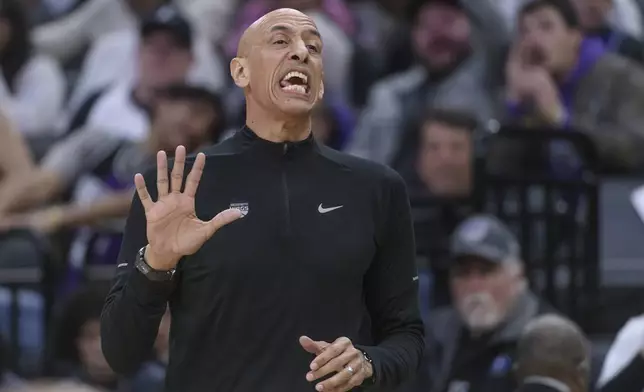 Sacramento Kings interim head coach Doug Christie shouts from the bench during the second half of an NBA basketball game against the Cleveland Cavaliers in Sacramento, Calif., Wednesday, March 19, 2025. (AP Photo/Randall Benton)