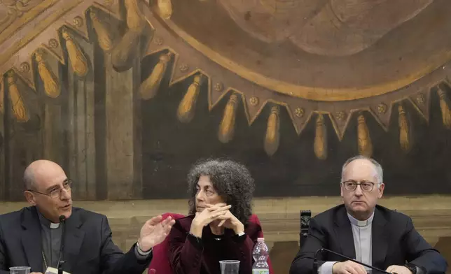 From left, Cardinal Victor Fernandez, Poet Maria Grazia Calandrone and Jesuit Father Antonio Spadaro meet the journalists during the presentation of a book by Pope Francis titled "Viva la Poesia" (long live poetry) in Rome, Friday, March 21, 2025. (AP Photo/Gregorio Borgia)