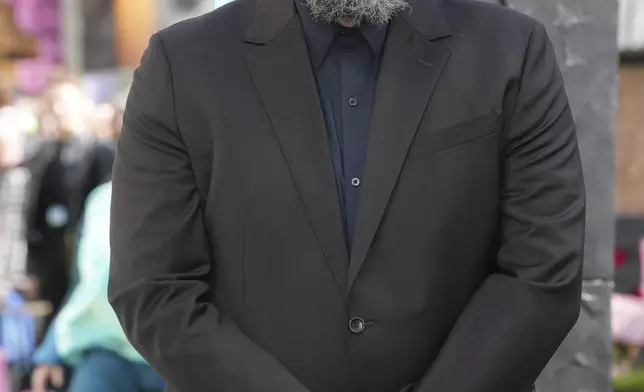 Director Jared Hess poses for photographers upon arrival at the World premiere of A Minecraft Movie on Sunday, March 30, 2025, in London. (Photo by Scott A Garfitt/Invision/AP)