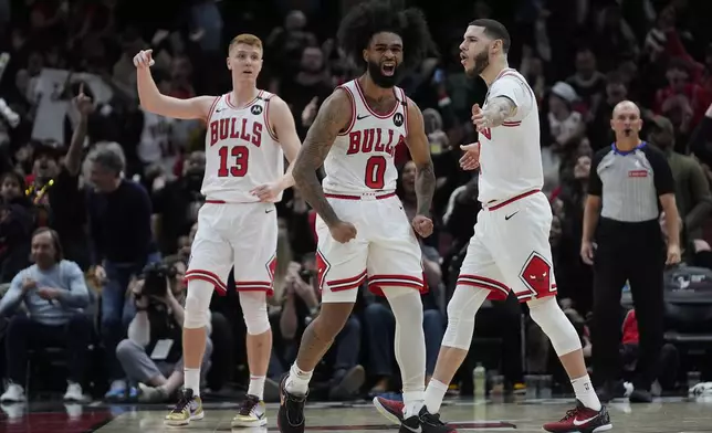 Chicago Bulls guard Coby White (0) reacts after sinking a 3-point basket against the Toronto Raptors during the second half of an NBA basketball game Friday, Feb. 28, 2025, in Chicago. (AP Photo/Erin Hooley)