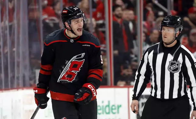 Carolina Hurricanes' Mikko Rantanen (96) protests against a penalty with an official during the third period of an NHL hockey game against the Edmonton Oilers in Raleigh, N.C., Saturday, March 1, 2025. (AP Photo/Karl DeBlaker)
