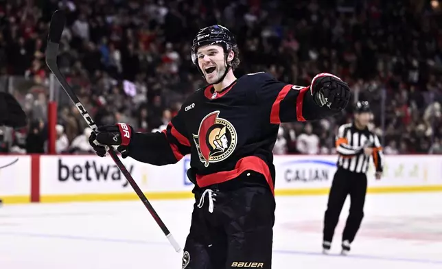FILE - Ottawa Senators' Josh Norris (9) celebrates a goal by Shane Pinto (12), not shown, during second period NHL hockey action against the Washington Capitals in Ottawa, on Thursday, Jan. 30, 2025. (Justin Tang/The Canadian Press via AP, File)