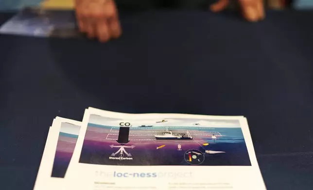 A diagram illustrating a project to add sodium hydroxide to the ocean to test whether the chemical can help slow climate change is displayed by the Woods Hole Oceanographic Institution at the Massachusetts Lobstermen's Association Annual Weekend and Trade Show, Friday, Jan. 31, 2025, in Hyannis, Mass. (AP Photo/David Goldman)