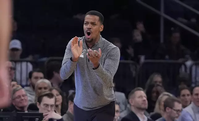 Providence head coach Kim English calls out to his team during the first half of an NCAA college basketball game against Butler at the Big East basketball tournament Wednesday, March 12, 2025, in New York. (AP Photo/Frank Franklin II)