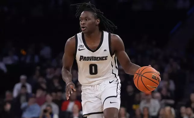 Providence's Wesley Cardet Jr. (0) looks to pass during the first half of an NCAA college basketball game against Butler at the Big East basketball tournament Wednesday, March 12, 2025, in New York. (AP Photo/Frank Franklin II)