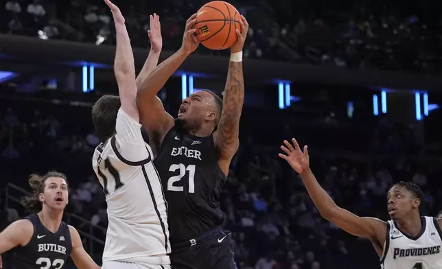 Butler's Dante Maddox Jr. (21) shoots over Providence's Ryan Mela (11) during the second half of an NCAA college basketball game at the Big East basketball tournament Wednesday, March 12, 2025, in New York. (AP Photo/Frank Franklin II)