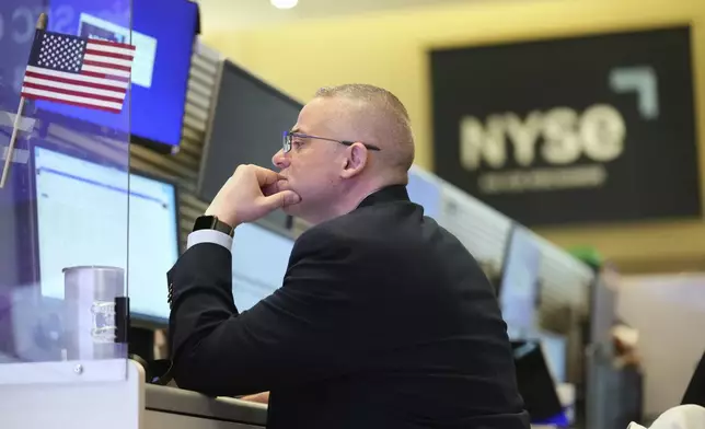 People work on the options floor at the New York Stock Exchange in New York, Tuesday, March 4, 2025. (AP Photo/Seth Wenig)