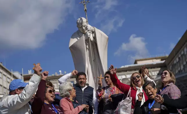 Catholic pilgrims from Mexico gather outside the Agostino Gemelli Polyclinic where Pope Francis continues to be hospitalized in Rome, Thursday, Feb. 27, 2025. (AP Photo/Bernat Armangue)