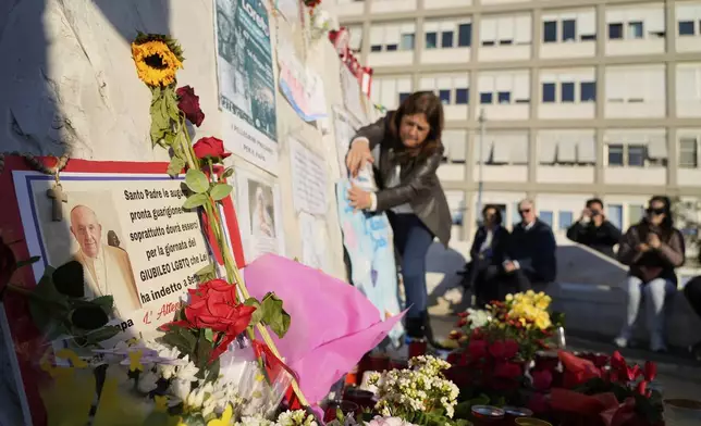 A placards are seen outside the Agostino Gemelli Polyclinic where Pope Francis is hospitalized in Rome, Tuesday, March 4, 2025. (AP Photo/Gregorio Borgia)