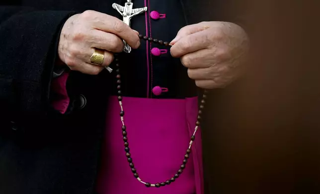 Bishop Franco Agostinelli leads a rosary prayer for Pope Francis in front of the Agostino Gemelli Polyclinic, in Rome, Saturday, March 8, 2025, where the Pontiff is hospitalized since Friday, Feb. 14. (AP Photo/Andrew Medichini)