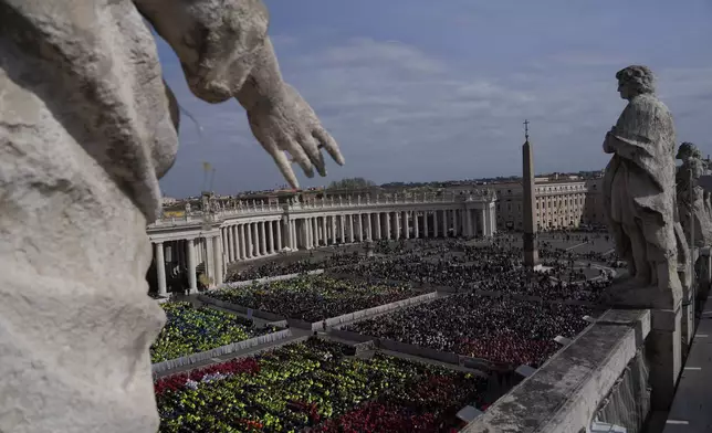 Members of different organizations of volunteers follow Cardinal Michael Czerny, delegate of Pope Francis who is being treated for pneumonia at Rome's Agostino Gemelli Polyclinic, celebrating a mass for the world of volunteers in St. Peter's Square at The Vatican, Sunday, March 9, 2025. (AP Photo/Gregorio Borgia)