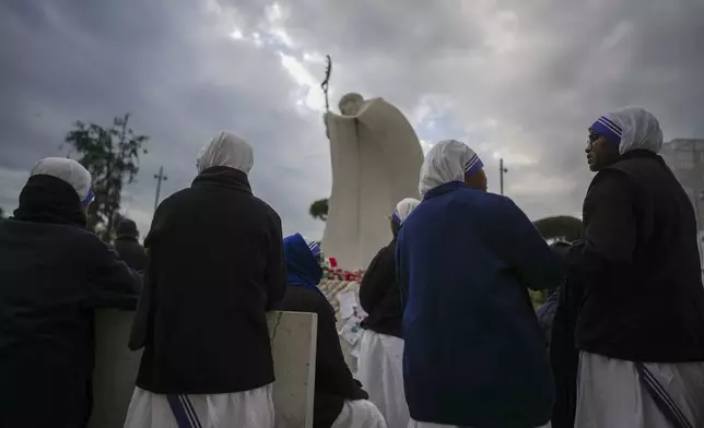 Nuns pray for Pope Francis in front of the Agostino Gemelli Polyclinic, in Rome, Sunday, March 9, 2025. (AP Photo/Andrew Medichini)