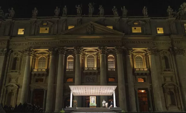 Cardinal Konrad Krajewski, Almsman of His Holiness, leads a nightly rosary prayer for the health of Pope Francis in St. Peter's Square at the Vatican, Sunday, March 2, 2025. (AP Photo/Mosa'ab Elshamy)